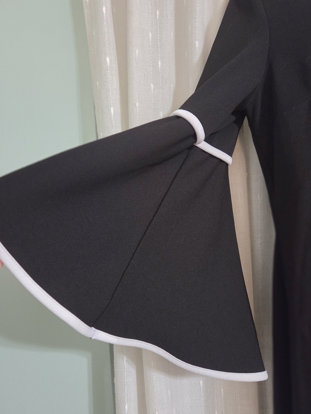 Elegant Black Midi Dress with White Trim and Bell Sleeves - Picture 2 of 5